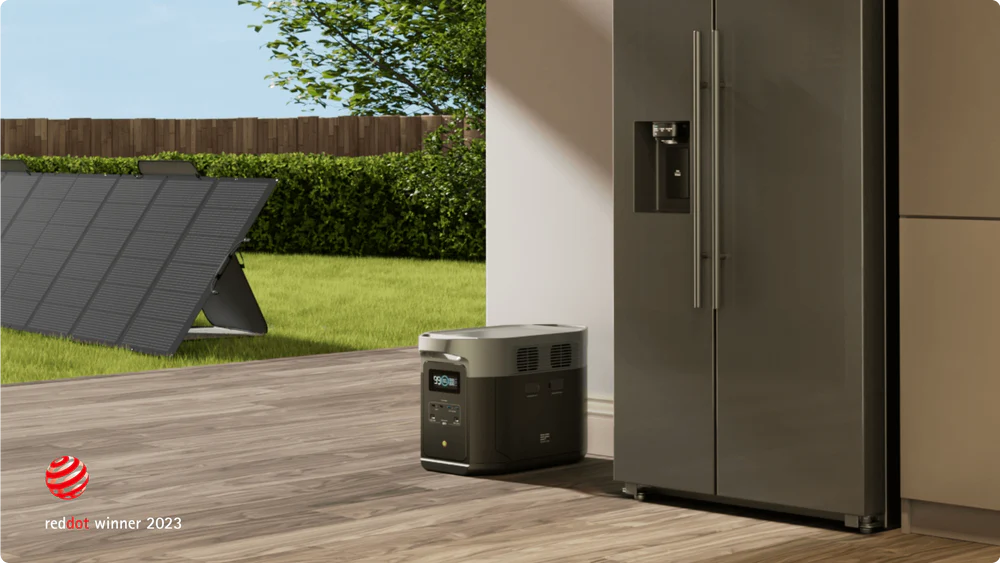 EcoFlow DELTA 2 Max Portable Power Station + One 160W Portable Solar Panel next to a refrigerator in a bright outdoor setting.