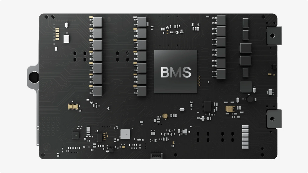 Close-up of a black circuit board featuring BMS technology components.