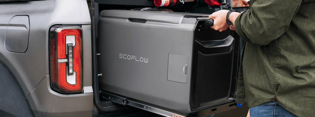 Person using EcoFlow GLACIER Classic Fridge 55L Portable Freezer in a truck bed.