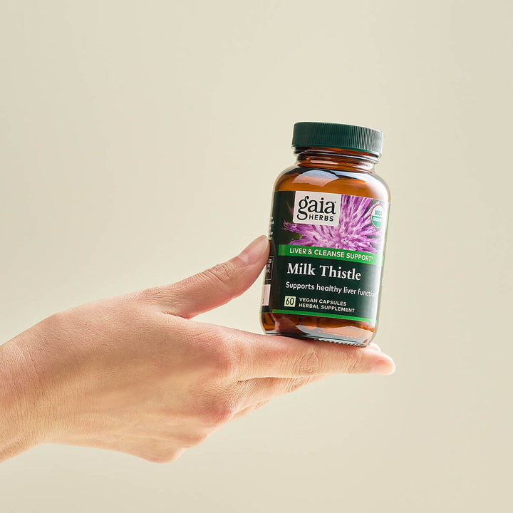 Gaia Herbs Milk Thistle 1000 120 Caps in hand, promotes liver health and detoxification support.