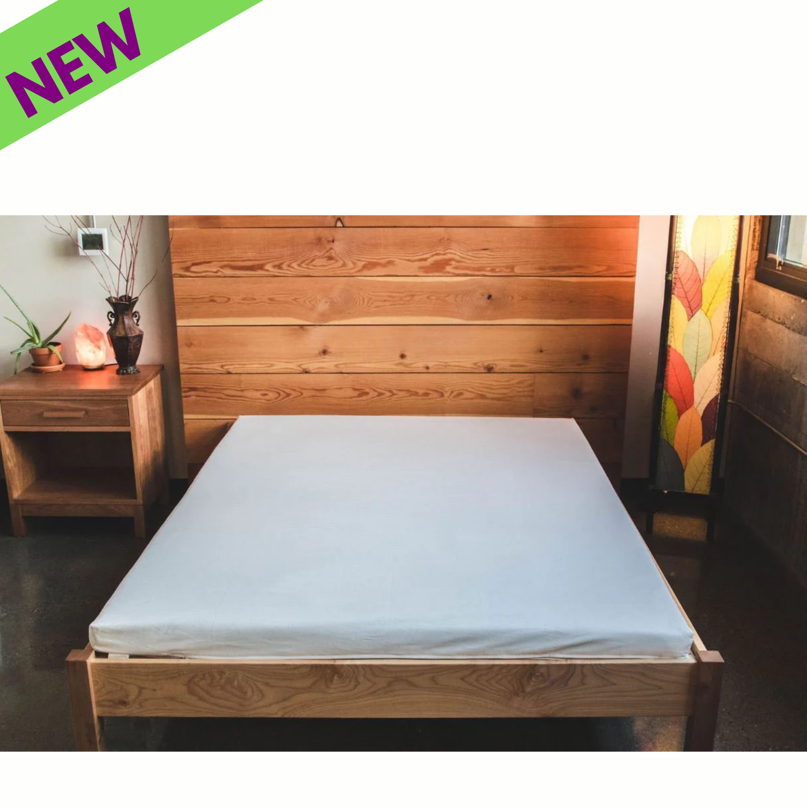 Holy Lamb Natural Wool Latex Shikibuton Mattress on a wooden bed frame in a cozy room.