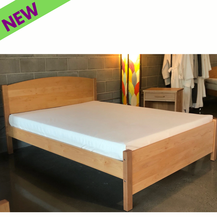 Holy Lamb Organics Wool &amp; Latex Mattress on a wooden bed frame with a minimalist design in a modern setting.