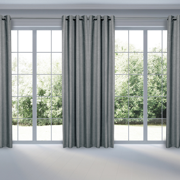 Faraday MAX Blackout CYBER Faraday RF EMF Shielding Curtains displayed in a bright room with large windows.