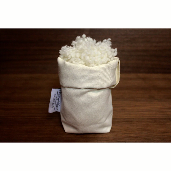 Sleepy Sheep Wool Bolus Natural Fiber Soft Comfort 3 Oz in a fabric pouch with fluffy wool filling.