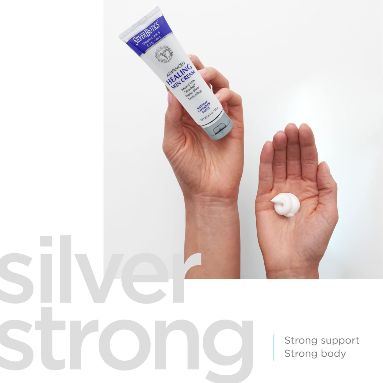 American Biotech Labs Silver Skin Cream tube held with a dollop on hand for hydrating soothing skin care.
