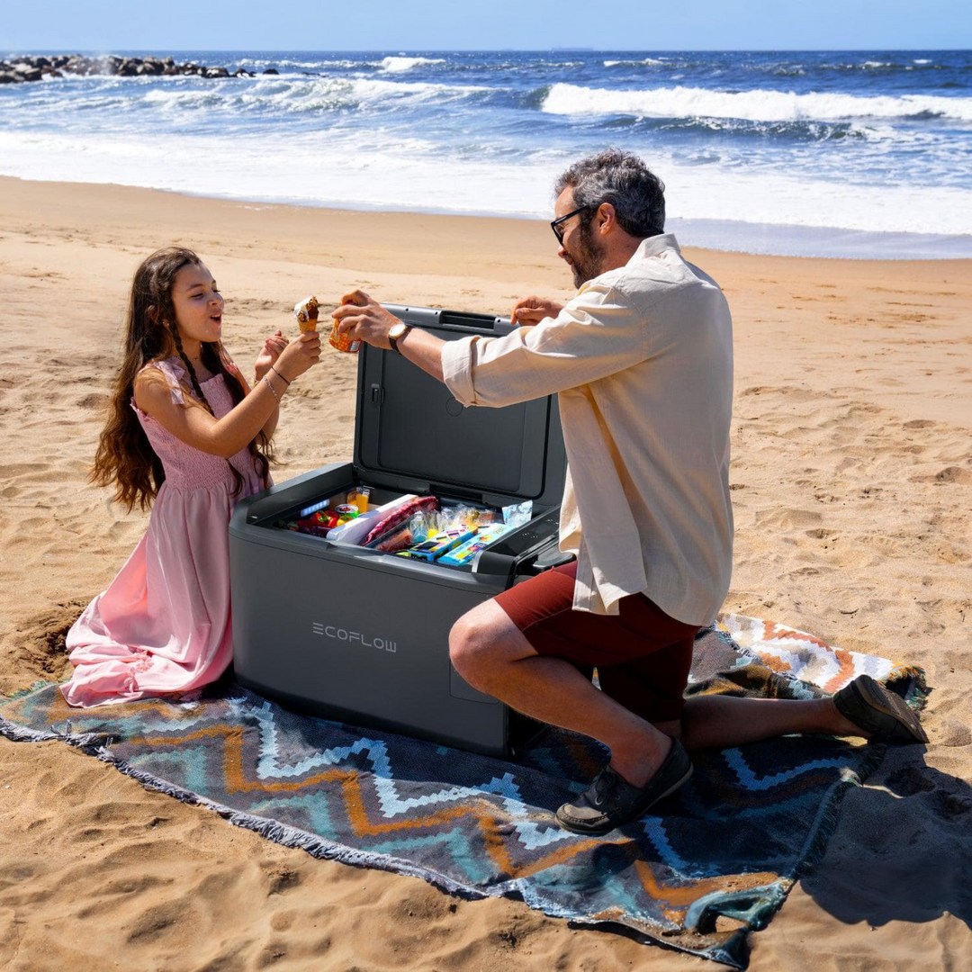 EcoFlow Glacier Portable Cooling Power being enjoyed on the beach with family, showcasing its storage and convenience.