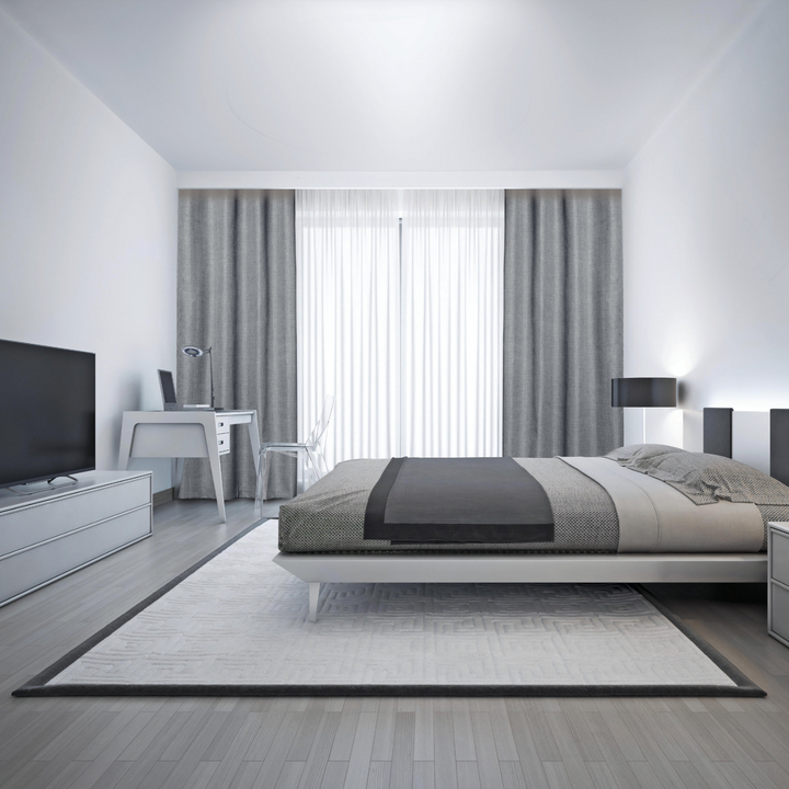 A modern bedroom featuring Faraday MAX Blackout CYBER Faraday RF EMF Shielding Curtains, with stylish decor and furniture.