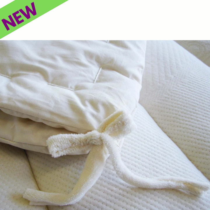 Holy Lamb Organics Comforter showing soft eco-wool with organic cotton shell and tie closure, ideal for all-season use.