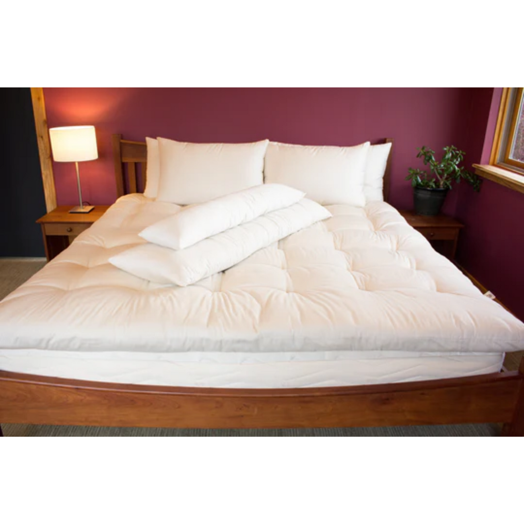 Holy Lamb Organics Body Size Pillows With Case on a cozy bed setting.