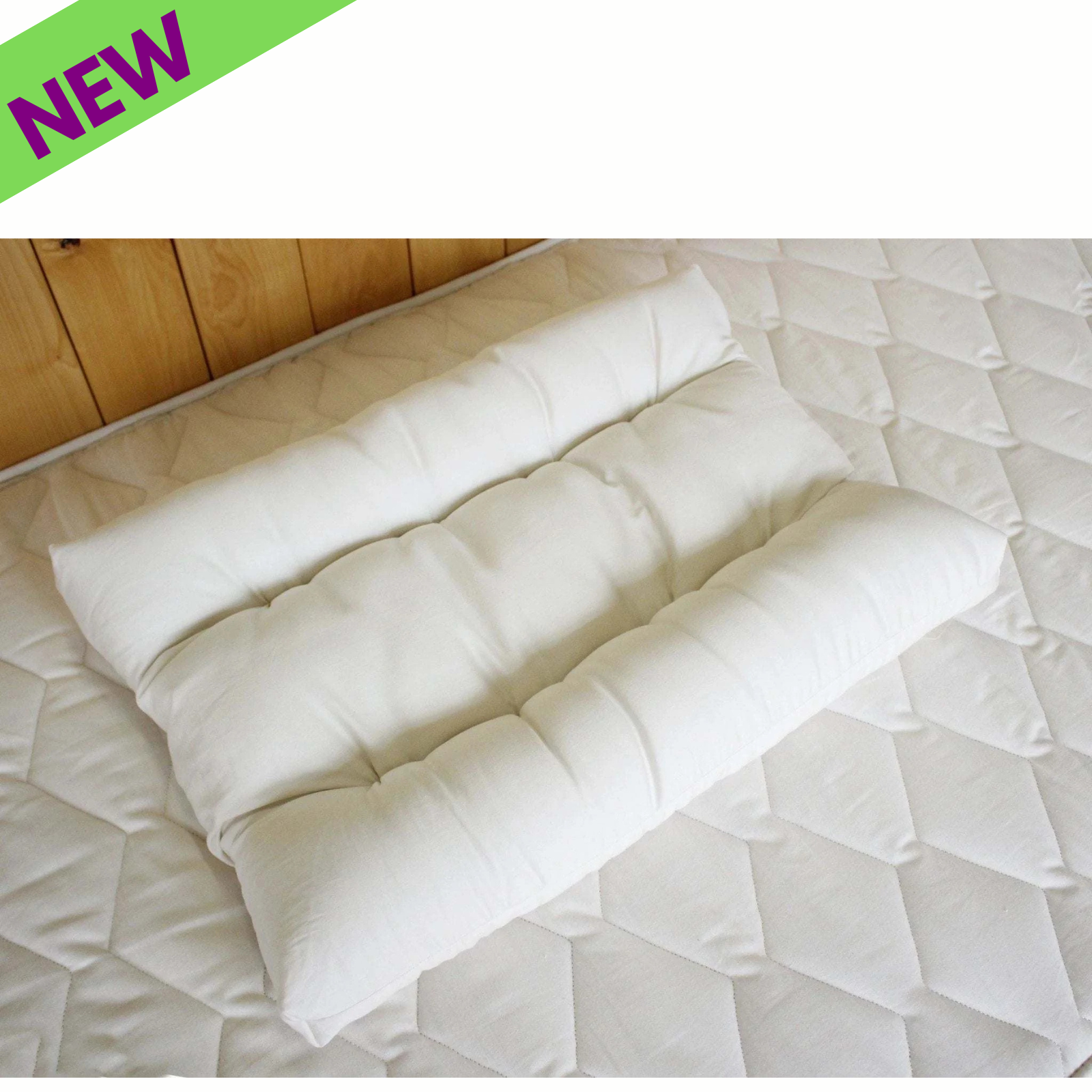 Holy Lamb Organics Neck Pillow on a mattress, natural eco-wool orthopedic design, 20" x 24", ships free to 48 states.