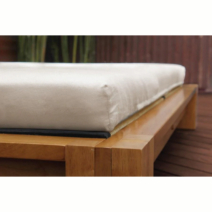 Soaring Heart Organic Latex Shikibuton Full on a wooden bed frame with a natural finish.