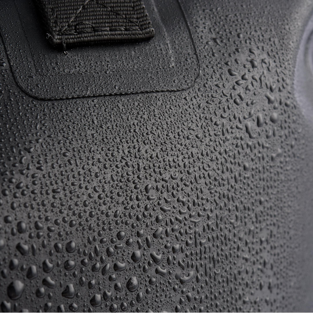 Close-up of droplets on the Faraday Dry Bag Sling Pack, showcasing its waterproof material for outdoor adventures.