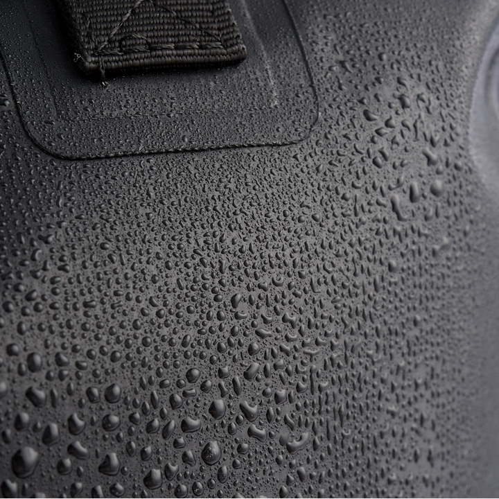 Close-up of droplets on the Faraday Dry Bag Sling Pack, showcasing its waterproof material for outdoor adventures.