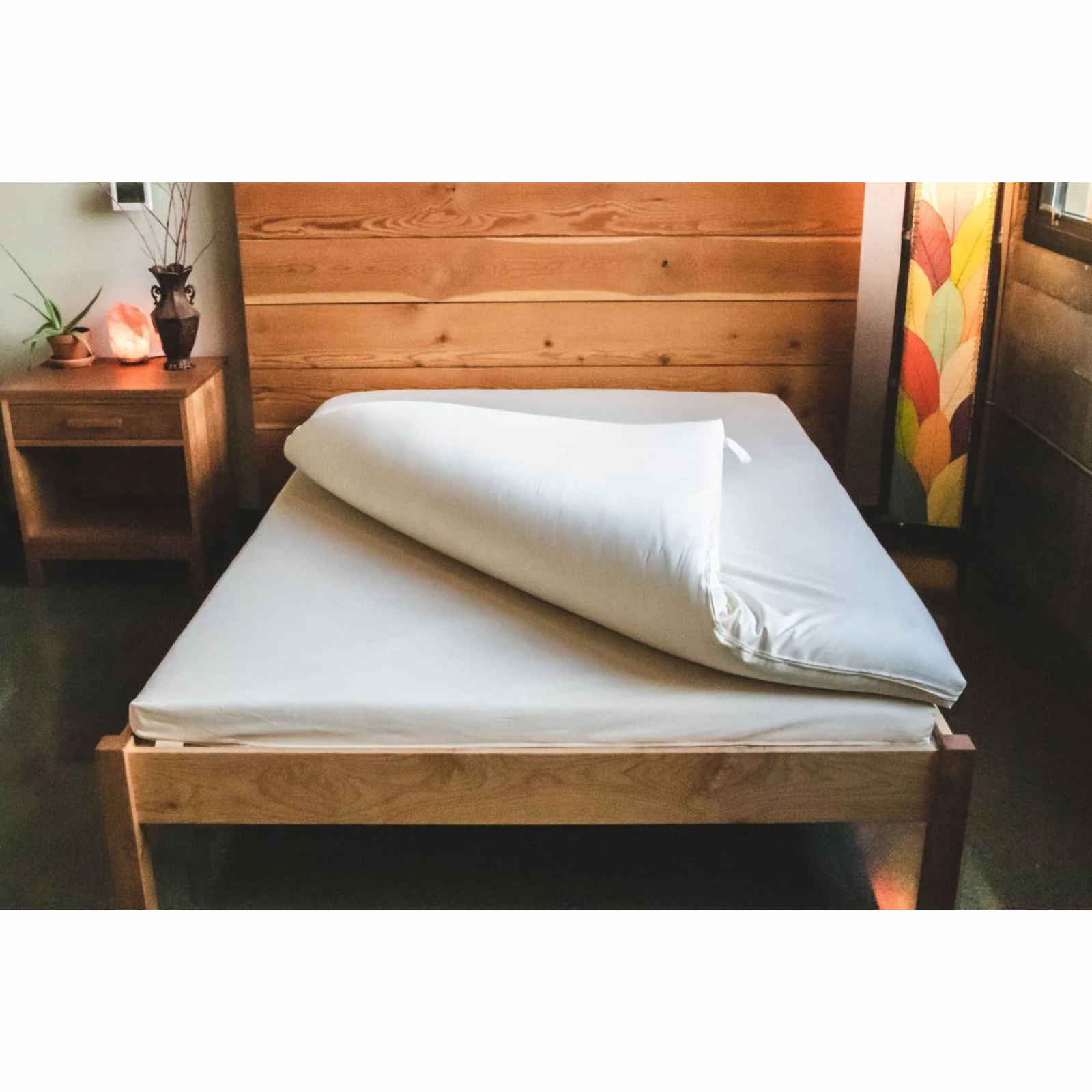 Holy Lamb Natural Wool Latex Shikibuton Mattress on a wooden bed frame, showcasing its organic bedding design.