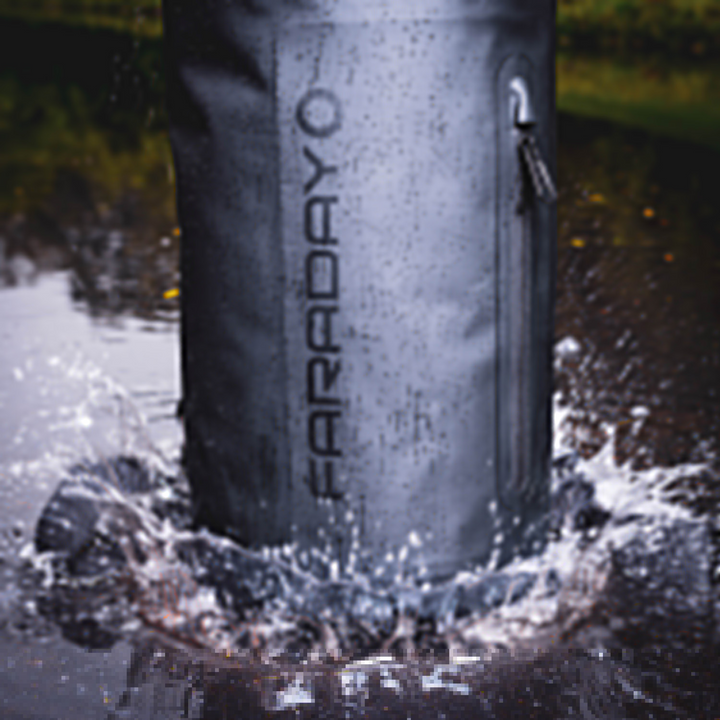 Faraday Dry Bag Sling Pack splashing in water, showcasing its waterproof features and sleek stealth black design.