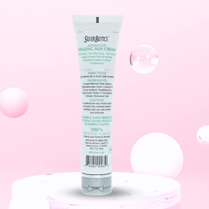 American Biotech Labs Silver Hand and Body Lotion 1.2 Oz in a tube against a pink backdrop, showcasing skin hydration benefits.