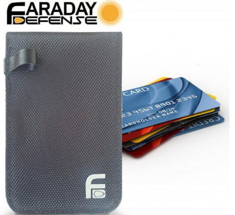 Faraday Jacket Anti Theft Key Fob Dry Bag in black holding credit cards, designed to protect against RFID, GPS, and cell signals.