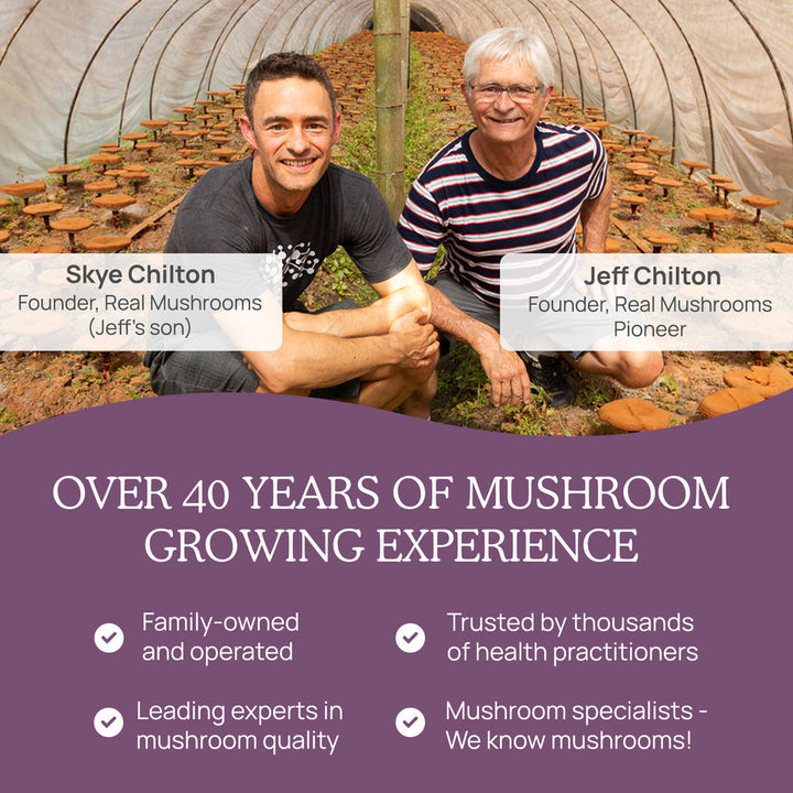 Skye and Jeff Chilton, founders of Real Mushrooms, showcasing their expertise in mushroom growing in a greenhouse.