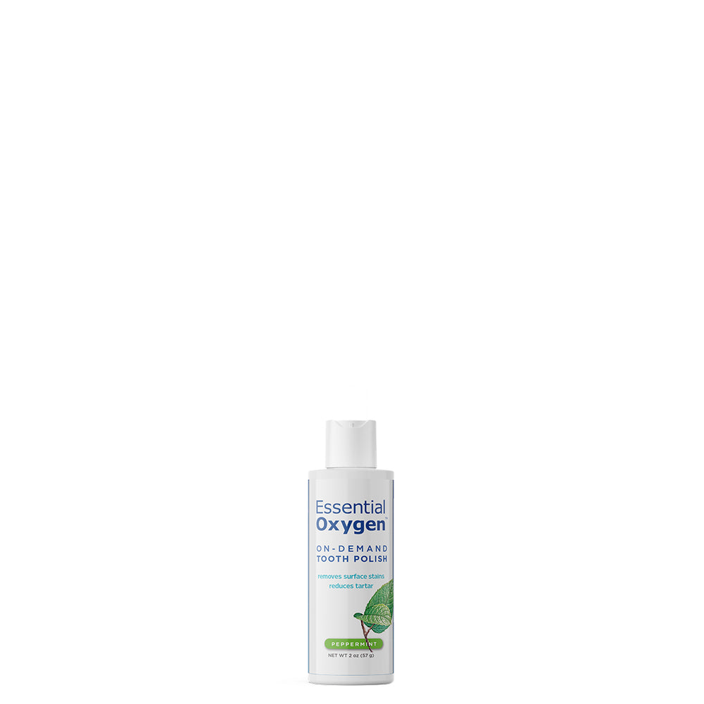 Essential Oxygen Tooth Polish bottle for stain removal and fresh breath, 2 oz peppermint flavor.
