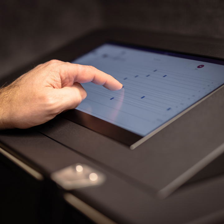 Person interacting with touchscreen of Faraday NEXUS Forensic Mini Lab RF Shielded Data Protection Box.