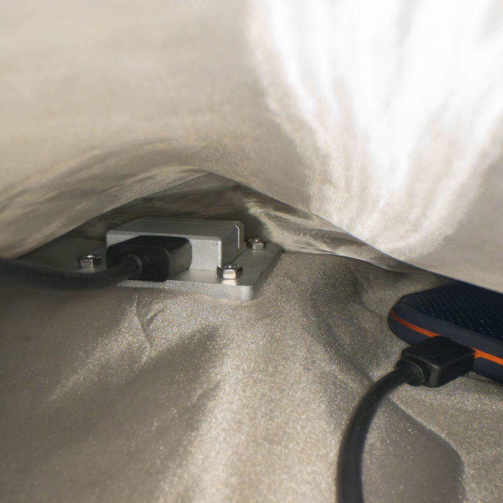 Faraday JACKET Pro Window Port Bag showing integrated charging port for uninterrupted device power.