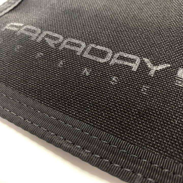Close-up of the Faraday Cordura Berry Compliant JACKET showing durable fabric and stitching details.