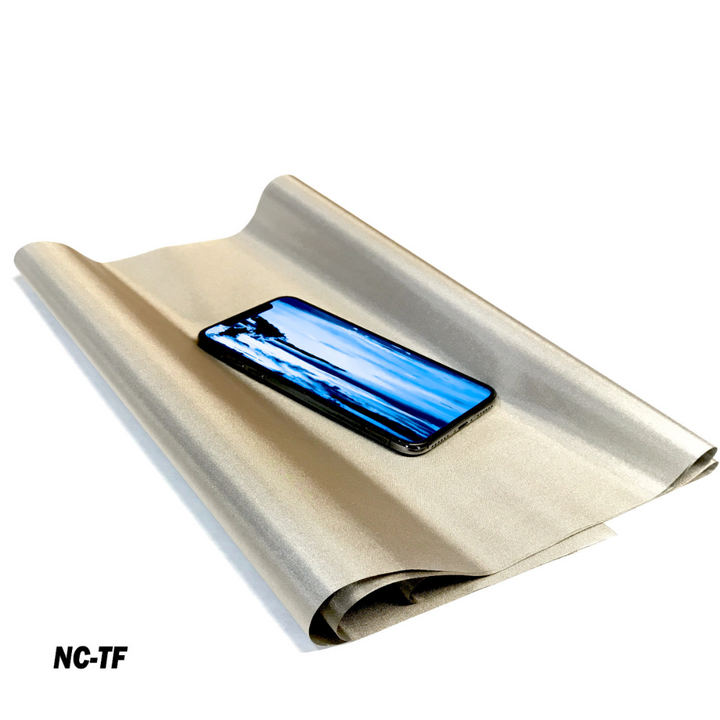 Faraday Cyber NC-TF Fabric with a smartphone on top showcasing its EMF/RFID shielding features
